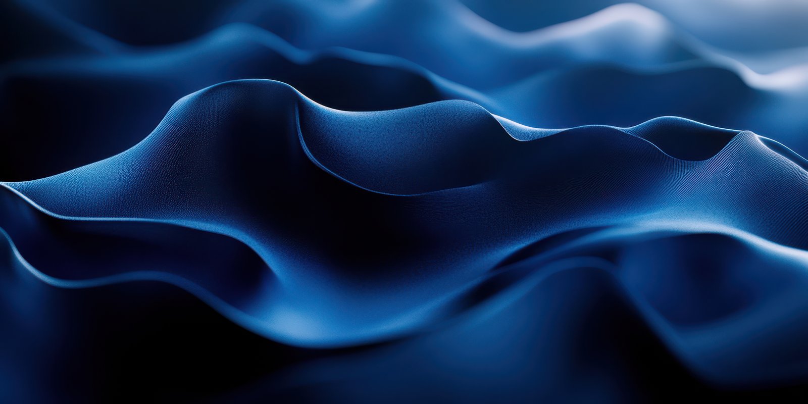 Delicate waves of blue fabric create an elegant texture in soft light